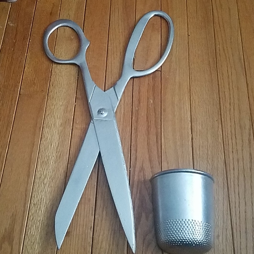 Giant scissors and thimble.